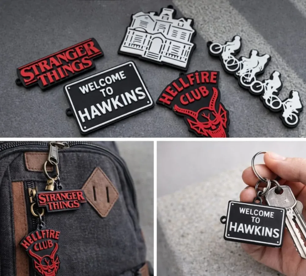 Chaveiros impressos em 3D com temas de Stranger Things, presos em mochila e em chaves